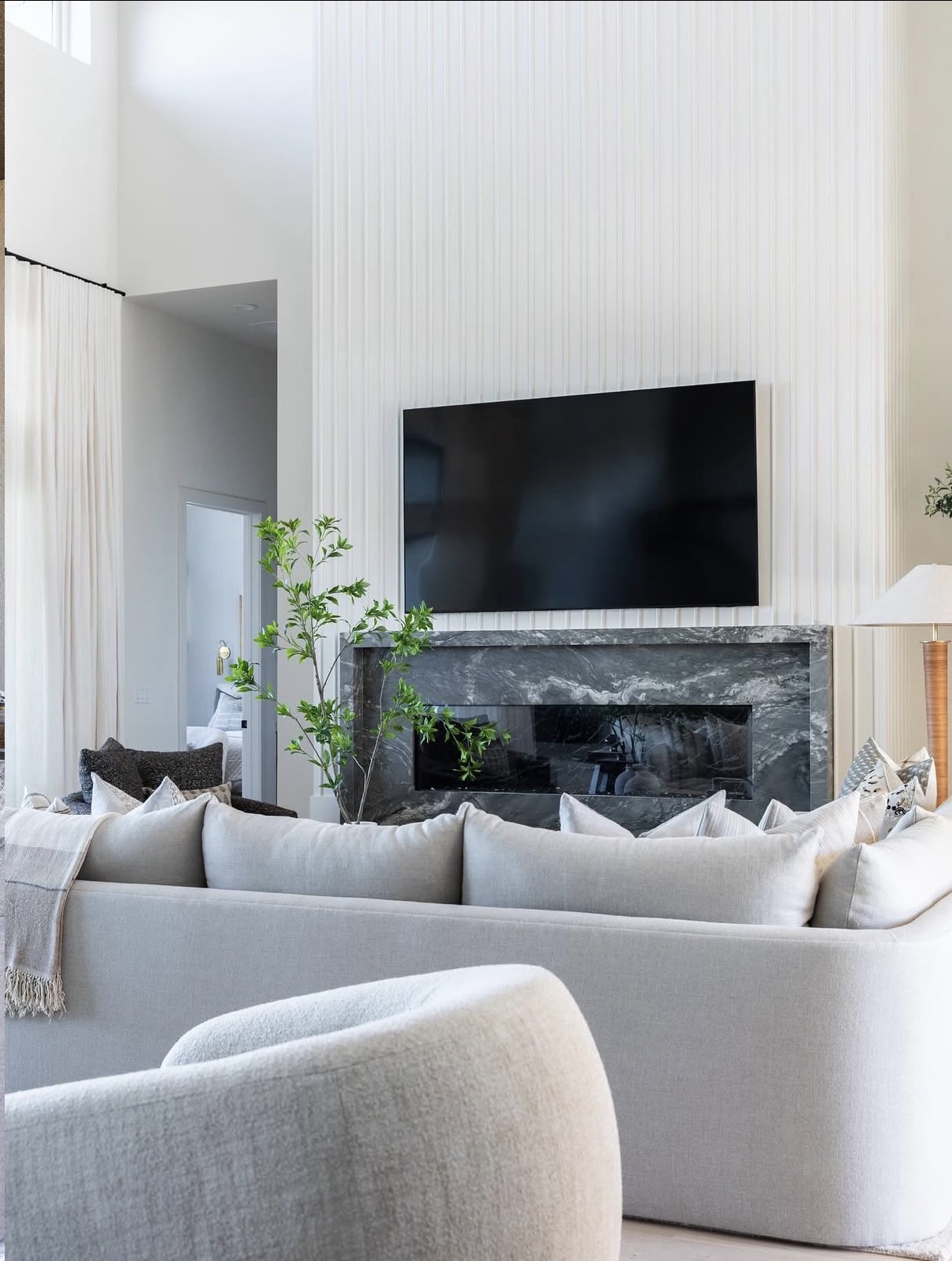 GNZ Construction full home remodel with custom fireplace and bright living room